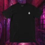 Front view of black shirt featuring a fallen knight sitting still, sword plunged into the ground, with a visibly large hole in his armor