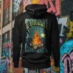 Back view of black Tropic Soul hoodie displaying the Moon Fire and night sky over the sea rear graphic placement and hood detail.