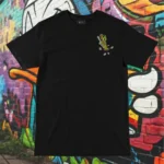 Front view of black tshirt featuring a chicken skewered by a wooden stick and intestines graphic.