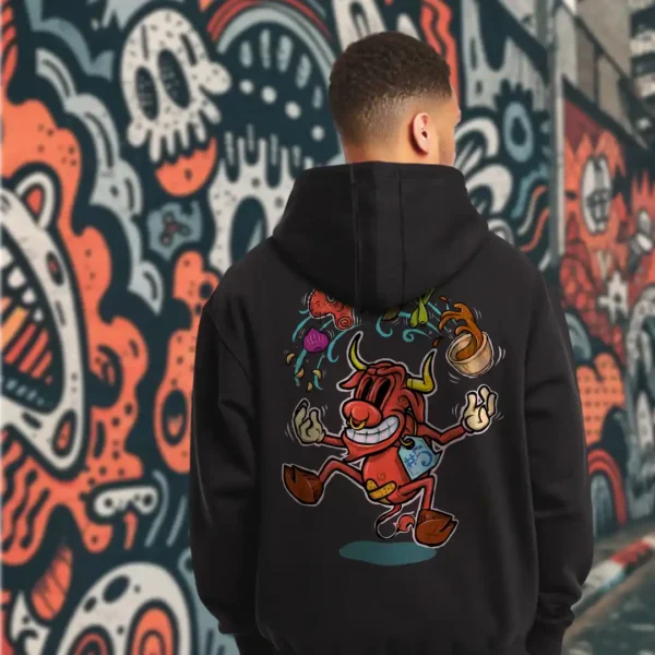 A male model with his back turned wearing a black Easy Days hoodie featuring a cow juggling spices and ingredients for an exotic soup with a bandaid on its crotch.