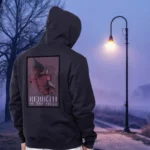 A male model with his back turned wearing a black Dark Fantasy hoodie featuring a grotesque creature, seemingly being born, wriggling from its attachment