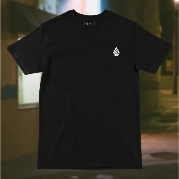 Front view of black shirt featuring a grotesque creature, seemingly being born, wriggling from its attachment