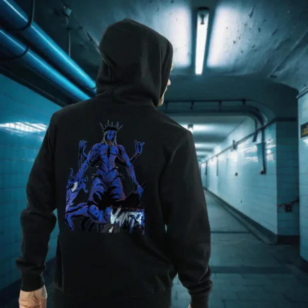 A male model with his back turned wearing a black Dark Fantasy hoodie featuring a deformed queen wearing a spike crown with several limbs, blue skin and multiple bodies for its legs