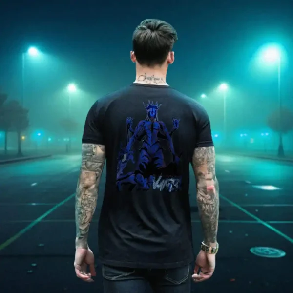 A male model with his back turned wearing a black Dark Fantasy shirt featuring a deformed queen wearing a spike crown with several limbs, blue skin and multiple bodies for its legs