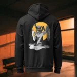 Back view of black Manifesto hoodie displaying a winged horned woman sat down, holding a dagger with an evil grin rear graphic placement and hood detail.