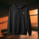 Front view of black pullover hoodie featuring a winged horned woman sat down, holding a dagger with an evil grin