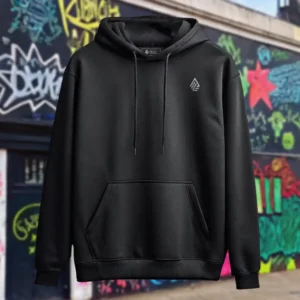 Front view of black pullover hoodie featuring a man relaxing on a hammock tied to the Skull Island's palm trees next to a giant wave graphic.