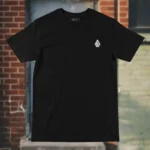 Front view of black tshirt featuring the Secret Skull, treasures, animals and waves graphic.