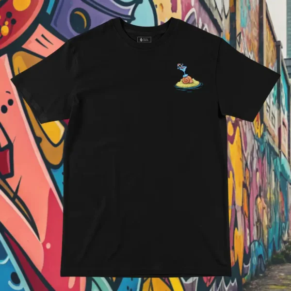 Front view of black tshirt featuring a roasted pig skewered by a bamboo stick, lying underneath an umbrella taking cover from the sun.