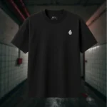 Front view of black tshirt featuring a man falling back as he's impaled by a spear